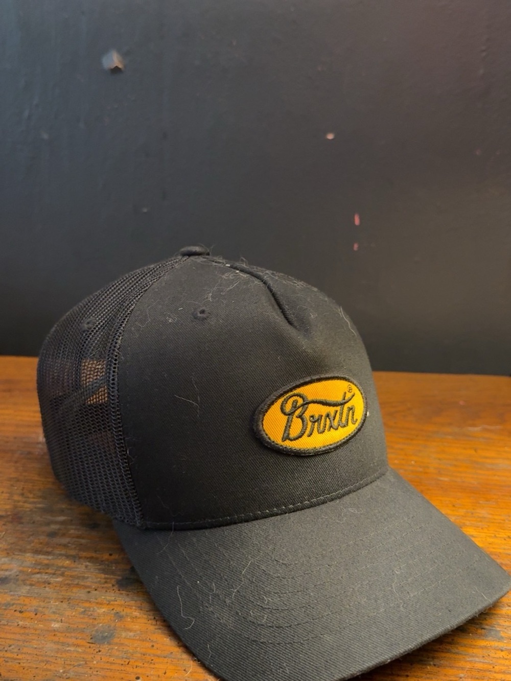 Brixton Black Baseball Trucker Hat with Gold Logo Patch